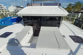 2024 Leopard 40 Powercat yacht deck with sun loungers and paddleboard.