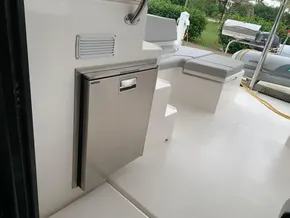 Leopard 45 yacht interior with seating and stainless steel fridge, 2021 model.