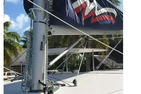 2020 Leopard 40 sailboat mast with sail cover, tropical background.