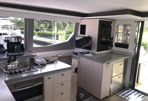 Modern kitchen interior of 2021 Leopard 45 catamaran with appliances and ample storage.