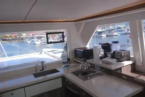 Modern kitchen interior on 2022 Leopard 45 yacht with marina view.