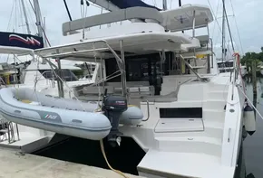 Leopard 45 catamaran with dinghy and Yamaha motor, docked at marina, 2021 model.