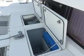 Open storage compartments on a 2017 Lagoon 42 catamaran deck.