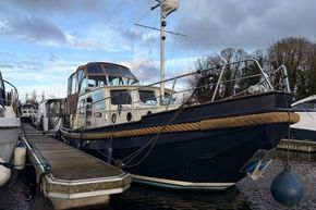Linssen 360 AC 1994 yacht docked at marina, featuring classic design and blue hull.