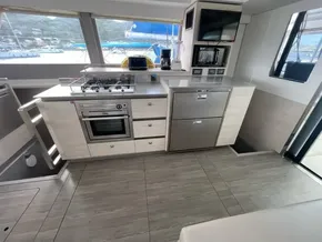 Modern kitchen interior on a 2020 Leopard 50 yacht, featuring appliances and sleek design.