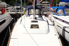 2017 Beneteau Oceanis 38 sailboat docked at a marina.