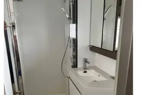 Bathroom interior of 2022 Leopard 53 Powercat yacht, featuring modern sink and shower.