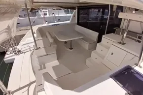 Spacious deck of 2018 Leopard 45 catamaran with seating and table.