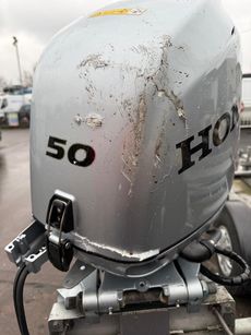 NEW HONDA BF50LRTU OUTBOARD ENGINE. SOME DAMAGE