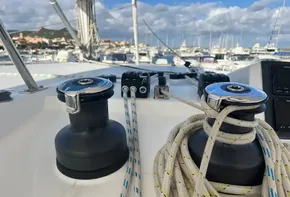 Sailing yacht deck with winches and ropes, Leopard 45, 2019 model, marina background.