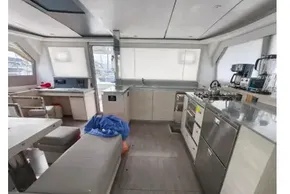 Modern interior of 2019 Leopard 50 yacht with kitchen and seating area.