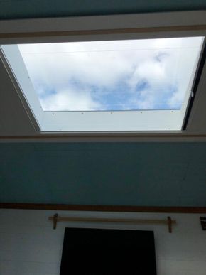 View through the skylight from the bed