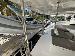 2019 Leopard 40 catamaran deck with seating and docked dinghy.