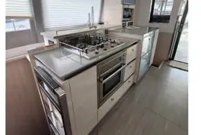 Modern kitchen interior on a 2020 Leopard 50 yacht, featuring sleek appliances and ample counter space.