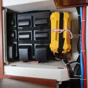 Battery compartment of 2018 Beneteau Oceanis 51.1 sailboat with cables and storage.