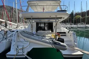 2024 Leopard 40 Powercat yacht docked with inflatable boat attached.