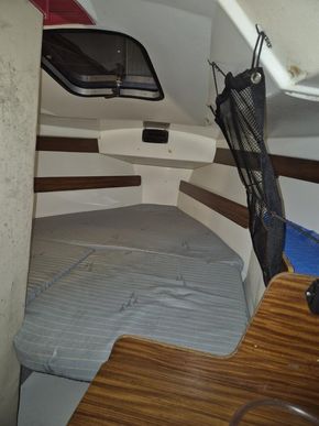 Forward double, storage under, cargo nets above
