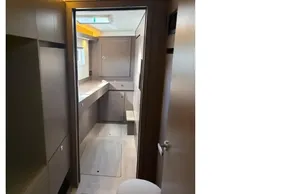 Modern interior of 2025 Leopard 46 yacht, featuring sleek cabinetry and ambient lighting.