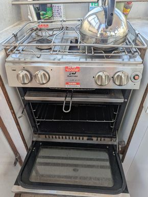Gimbled 2 burner, grill, oven, piezo ignition  with overhead solar powered extraction fan