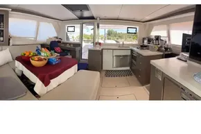 Luxurious 2022 Leopard 45 yacht interior with modern kitchen and cozy seating area.