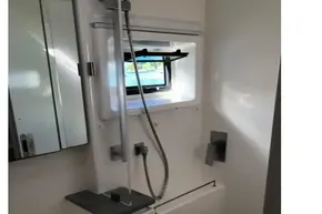 Modern bathroom in a 2020 Leopard 40 yacht with sleek fixtures and a shower.