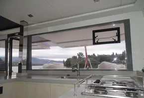 Modern kitchen interior on 2017 Leopard 45 yacht with scenic window view.