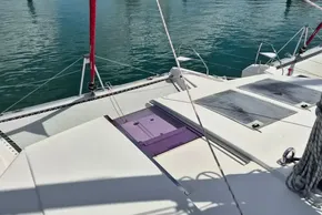 2021 Leopard 45 catamaran deck with solar panels and red sail ropes.