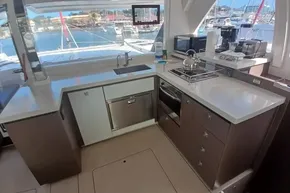 Modern kitchen interior on 2022 Leopard 45 yacht with appliances and marina view.