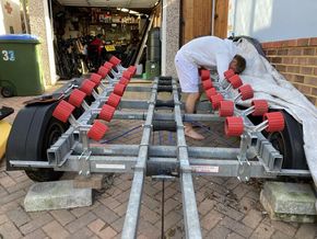 Trailer with new roller bunks being fitted