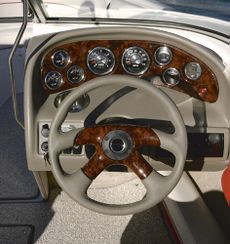 Crownline Bowrider 190 LS Helm features guages with stainless steel bezels and lifetime warranty. Shown with optional woodgrain dash and wheel insert.