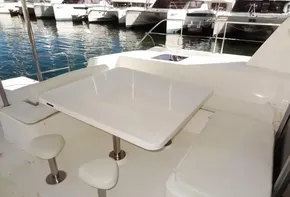Outdoor seating area on a 2015 Leopard 51 Powercat yacht.