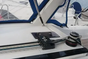 Close-up of 2019 Beneteau Oceanis 41.1 sailboat deck with winch and ropes.