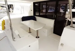 2017 Leopard 43 Powercat yacht with spacious outdoor seating and dining area.