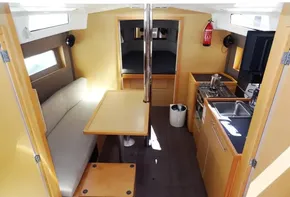 Interior of 2017 Beneteau Oceanis 38 sailboat with kitchen, dining area, and sleeping quarters.