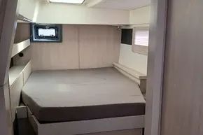 2017 Leopard 48 yacht interior cabin with bed and window.