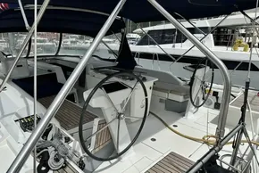 2023 Beneteau Oceanis 51.1 yacht cockpit with dual steering wheels and teak flooring.