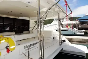 2017 Leopard 43 Powercat docked, featuring spacious deck and stainless steel railings.