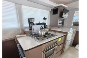Modern kitchen in 2021 Leopard 50 yacht with stove, oven, and appliances.