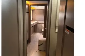 Interior hallway of 2025 Leopard 46 yacht, featuring modern design and wood finishes.