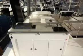 2017 Leopard 43 Powercat yacht with outdoor kitchen and seating area.