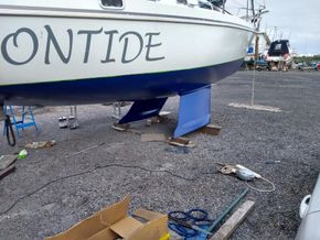 Moontide out of the water in 2022 before her final to coats of grey Hempel to pack epoxy are applied 