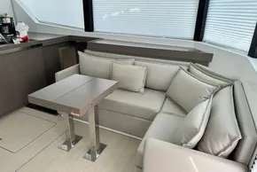 Luxurious interior of 2025 Robertson and Caine Leopard 46 Powercat with modern seating and table.