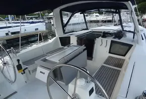 2017 Beneteau Oceanis 41 sailboat cockpit with dual steering wheels and navigation equipment.