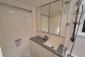 Modern bathroom interior in a 2020 Leopard 45 yacht, featuring sleek fixtures and mirrored cabinets.