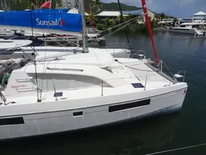 2021 Leopard 40 catamaran docked in marina, featuring Sunsail branding and sleek design.