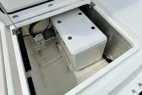 Open engine compartment of 2021 Leopard 50 yacht, showing machinery and oil container.