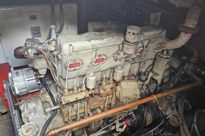 Engine of a 1926 Dutch Barge Luxemotor, showcasing vintage mechanical components.