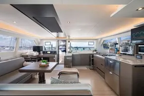 Luxurious interior of a 2022 Leopard 50 yacht with modern kitchen and seating area.