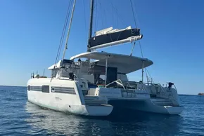2017 Lagoon 42 catamaran sailing on calm blue waters.