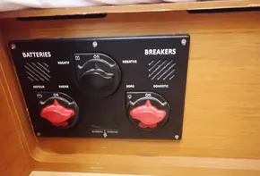 Electrical panel on 2019 Jeanneau Sun Odyssey 440 sailboat, featuring battery and breaker switches.